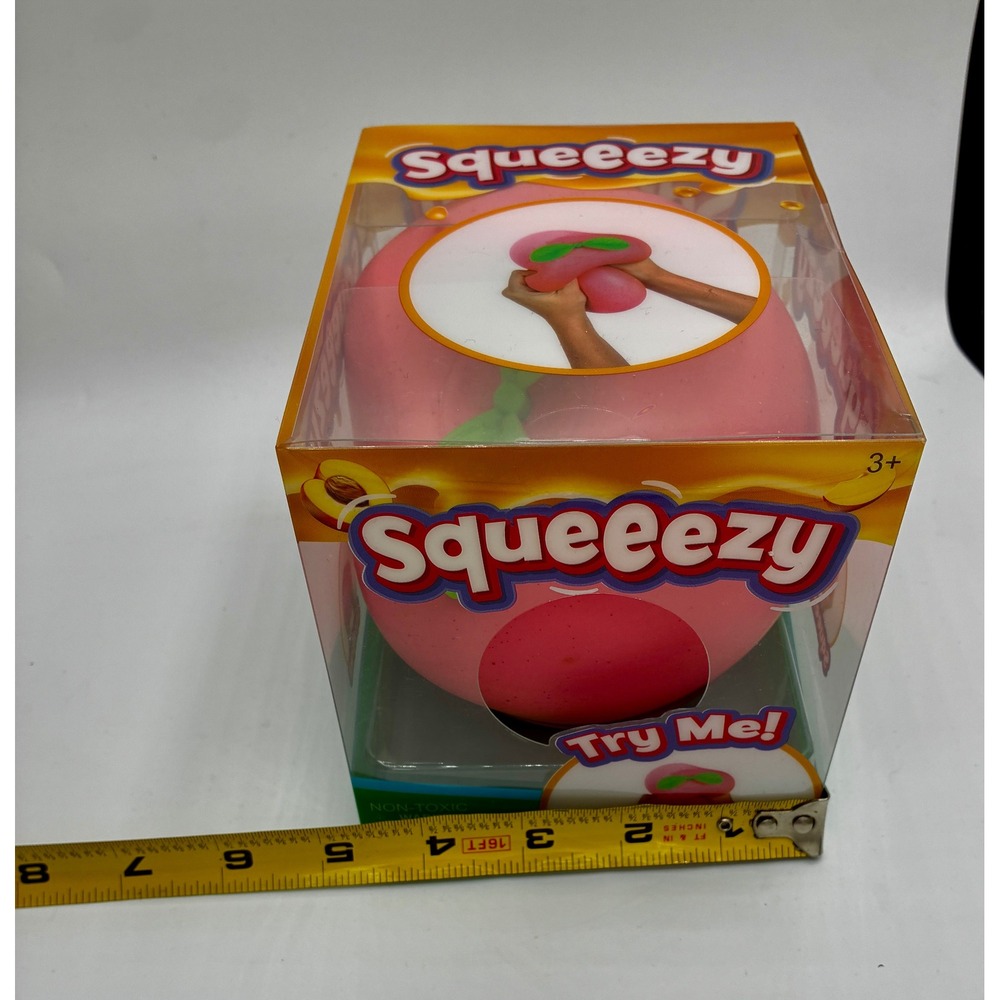 Squeeezy Authentic NIB Sunny Days Peach Viral Fidget Stretch Squeeze Toy Pink